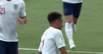 A Soccer Player Wearing A White Jersey With The Number 1 On It Is Standing On A Soccer Field . GIF