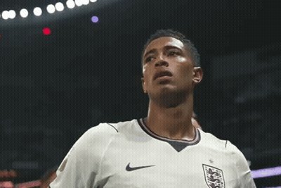 A Soccer Player Wearing A White Nike Jersey With A Lion On The Front GIF