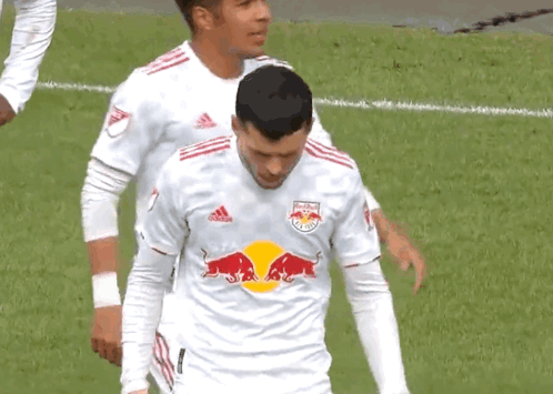 A Soccer Player Wearing A White Red Bull Jersey GIF