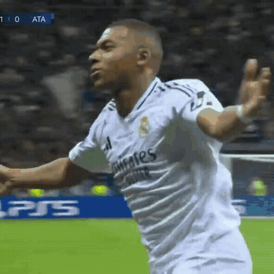 A Soccer Player Wearing A White Shirt That Says Fly Emirates GIF