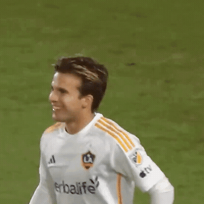 A Soccer Player Wearing A White Shirt With Herbalife On It GIF