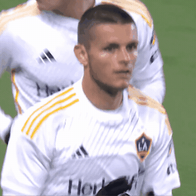A Soccer Player Wearing A White Shirt With The Word Galaxy On It GIF