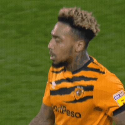 A Soccer Player Wearing A Yellow And Black Jersey That Says Sportpesa GIF