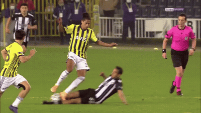 A Soccer Player Wearing A Yellow And Black Jersey With Avis On It Kicks The Ball GIF