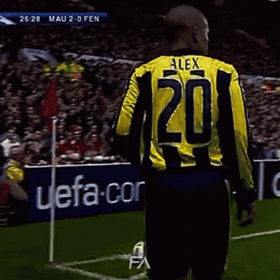 A Soccer Player Wearing A Yellow And Black Jersey With The Number 20 On It GIF