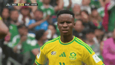 A Soccer Player Wearing A Yellow And Green Jersey With The Number 21 On It GIF