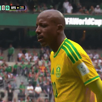 A Soccer Player Wearing A Yellow And Green Shirt With The Number 10 On It GIF