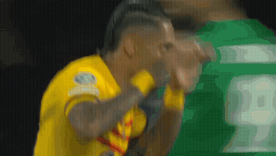 A Soccer Player Wearing A Yellow Jersey With The Number 18 On It GIF
