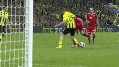 A Soccer Player Wearing A Yellow Jersey With The Number 25 Kicks The Ball GIF