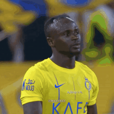 A Soccer Player Wearing A Yellow Shirt That Says Arya On It GIF