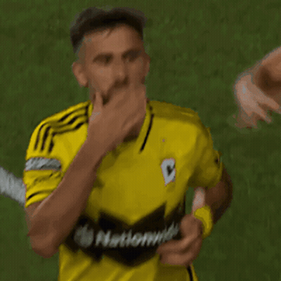 A Soccer Player Wearing A Yellow Shirt That Says National On It GIF