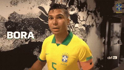 A Soccer Player Wearing A Yellow Shirt With The Number 5 On It GIF
