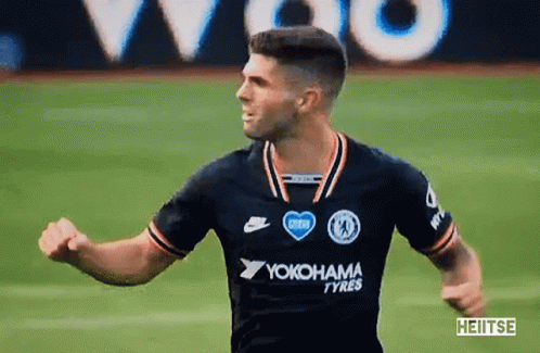 A Soccer Player Wearing A Yokohama Tyres Jersey Is Running On The Field GIF