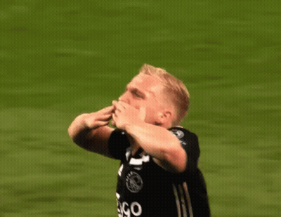 A Soccer Player Wearing A Ziggo Jersey Is Raising His Hands In The Air GIF