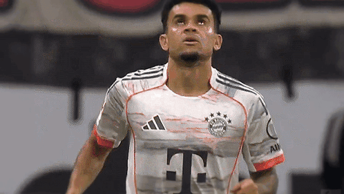 A Soccer Player Wearing An Adidas Shirt With The Letter T On The Front GIF