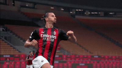 A Soccer Player Wearing An Emirates Fly Better Jersey Celebrates A Goal GIF
