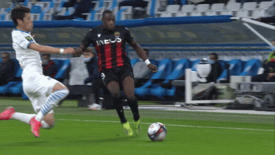 A Soccer Player Wearing An Ineos Jersey Dribbles A Ball GIF