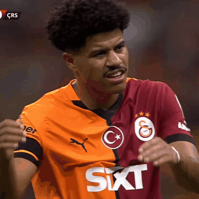 A Soccer Player Wearing An Orange And Maroon Jersey With Sixt Written On It GIF