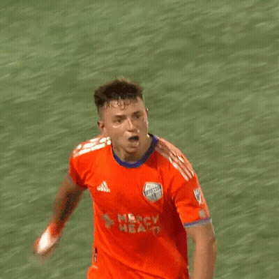 A Soccer Player Wearing An Orange Jersey That Says Nbc Health On It GIF