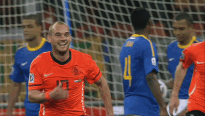 A Soccer Player Wearing An Orange Jersey With The Number 13 GIF