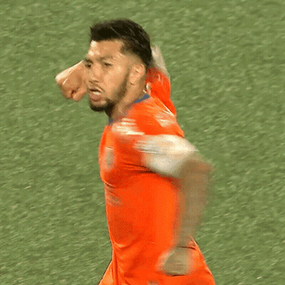 A Soccer Player Wearing An Orange Jersey With The Word Capital On The Sleeve GIF