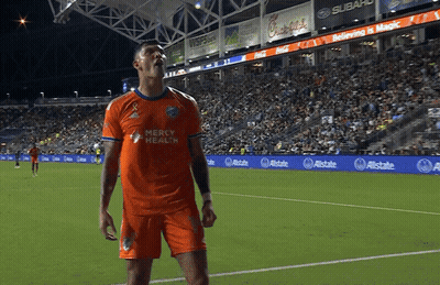 A Soccer Player Wearing An Orange Mercy Health Jersey GIF