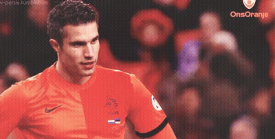 A Soccer Player Wearing An Orange Shirt With Knvb On The Front GIF