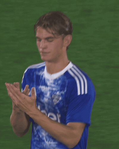 A Soccer Player Wearing An Uber Jersey Covering His Face With His Hands GIF