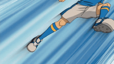 A Soccer Player Wearing Blue Socks And White Shorts Is Kicking A Ball GIF