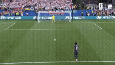 A Soccer Player Wearing Number 13 Kicks The Ball Into The Goal GIF