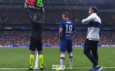 A Soccer Player Wearing Number 19 Stands On The Field GIF
