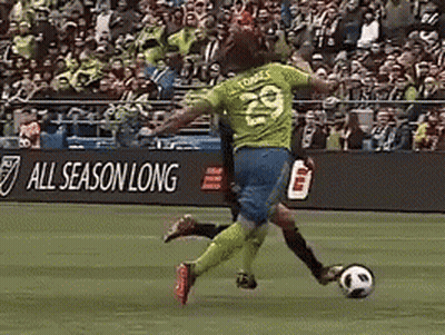 A Soccer Player Wearing Number 29 Is Kicking The Soccer Ball GIF