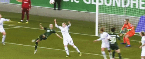 A Soccer Player Wearing Number 5 Jumps In The Air GIF