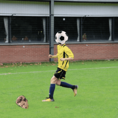 A Soccer Player With A Soccer Ball On His Head In Front Of A Brick Wall GIF