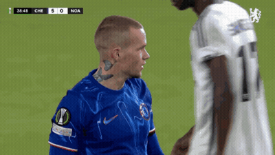 A Soccer Player With A Tattoo On His Neck Talks To Another Player On The Field GIF