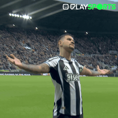 A Soccer Player With His Arms Outstretched Is Wearing A Black And White Striped Shirt That Says Iseki GIF