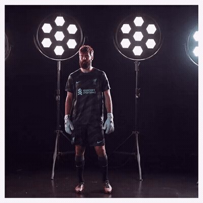A Soccer Player With The Name Allison In White GIF