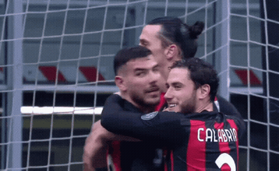 A Soccer Player With The Name Calabria On His Back Is Hugging Another Player GIF