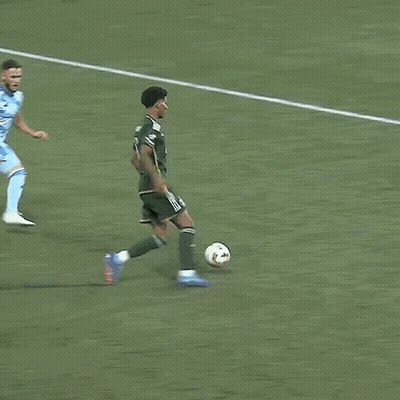 A Soccer Player With The Number 1 On His Jersey Kicks The Ball GIF