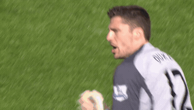 A Soccer Player With The Number 1 On His Jersey Stands On The Field GIF