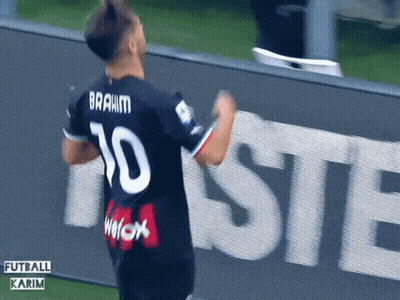A Soccer Player With The Number 10 On His Jersey Is Celebrating GIF