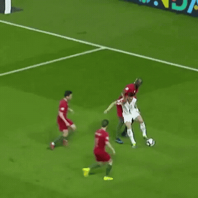 A Soccer Player With The Number 10 On His Jersey Is Kicking A Ball GIF
