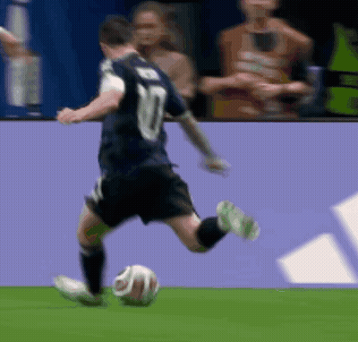 A Soccer Player With The Number 10 On His Jersey Is Kicking A Soccer Ball GIF