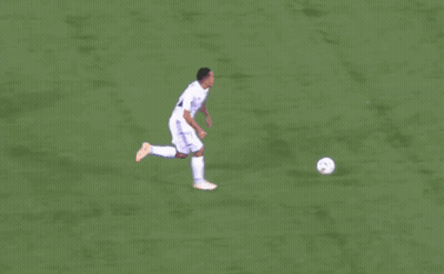 A Soccer Player With The Number 10 On His Jersey Kicks The Ball GIF