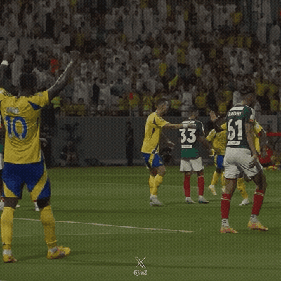 A Soccer Player With The Number 10 On His Jersey Stands On The Field GIF