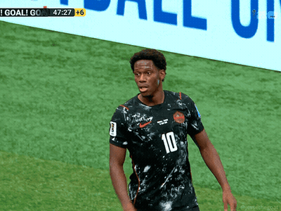 A Soccer Player With The Number 10 On His Jersey Stands On The Field GIF