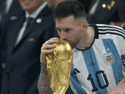 A Soccer Player With The Number 10 On His Shirt Is Kissing A Trophy GIF