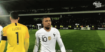 A Soccer Player With The Number 10 On His Shirt Is Standing Next To A Goalie . GIF