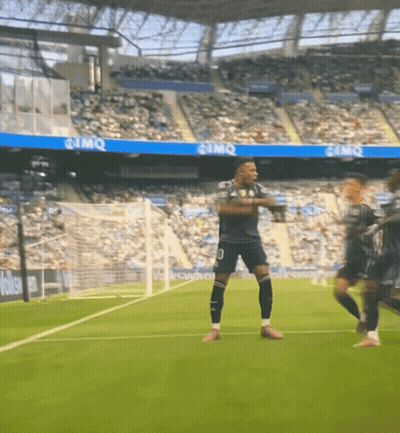 A Soccer Player With The Number 10 On His Shorts Is Dancing On The Field GIF