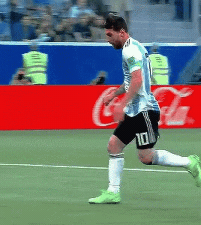 A Soccer Player With The Number 10 On His Shorts Is Running On The Field . GIF